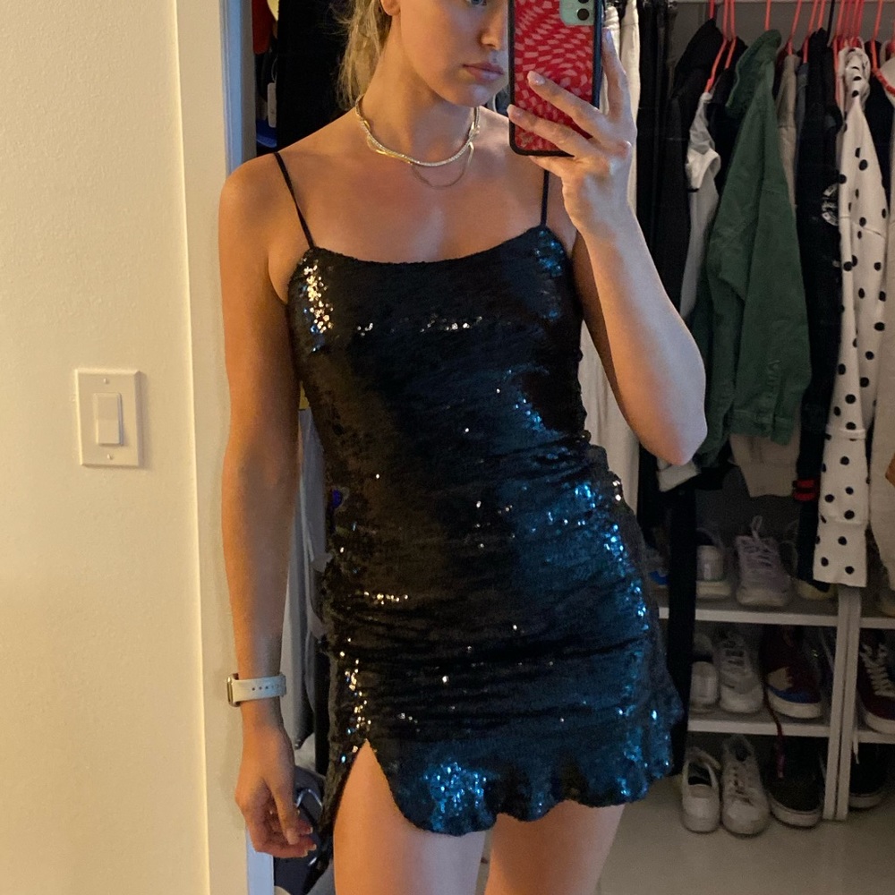 Black sequence spaghetti strap dress with small slit and flare bottom